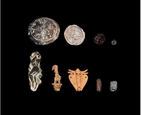 1st millennium BC and later. A mixed group of items comprising: a ceramic stamp seal with a rampant lion; a ceramic domed lid