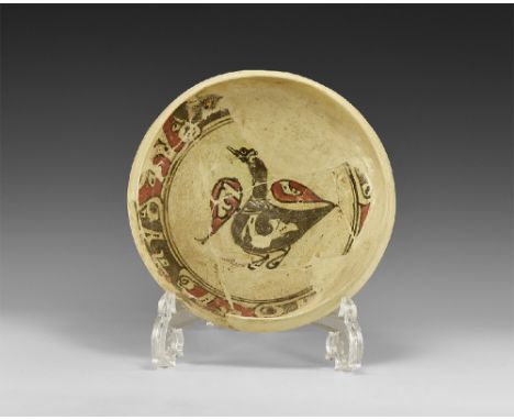 10th century AD.
A reconstructed Samarkand-type ceramic bowl with central motif of a black bird with red wings spread for fli