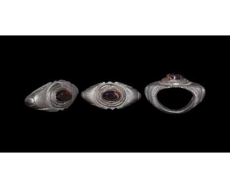 3rd century AD. A D-section silver hoop with leaf to each shoulder and ropework border to the void, flat scaphoid plaque with