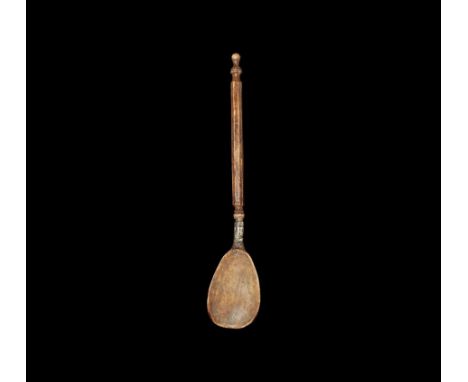 16th century AD. A Scandinavian bone spoon with silver band for attaching the bowl to handle; bowl is wide with shallow dish;