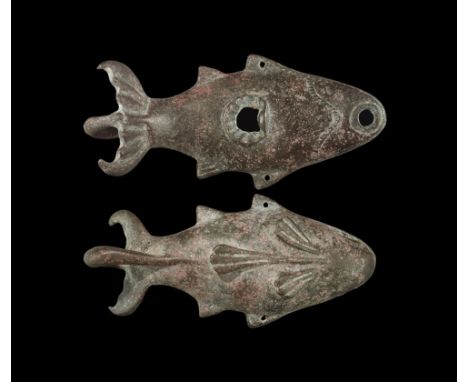 1st-2nd century AD.
A hollow-formed bronze lamp formed as a porpoise, with arched back and ribbed tail; loop handle beneath t