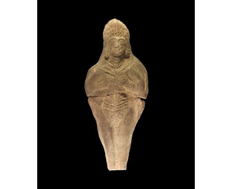 3rd millennium BC. A moulded ceramic figurine of a female in crested headdress with ropework collar, belt and loincloth, supp
