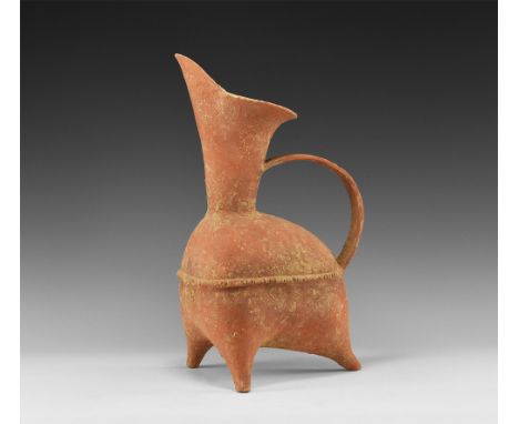 Neolithic, Dawenkou Culture, 2800-2400 BC. A ceramic Gui tripod vessel with upward pointing spout with flared rim and taperin