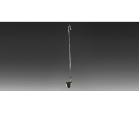 2nd millennium BC. A bronze ladle comprising a deep conical bowl, square-section handle with fluted face, ribbed panel and ho