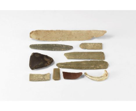 Neolithic, 5th-3rd millennium BC. A group of various stone implement items, one hand axe, one bone pendant. 173 grams total, 