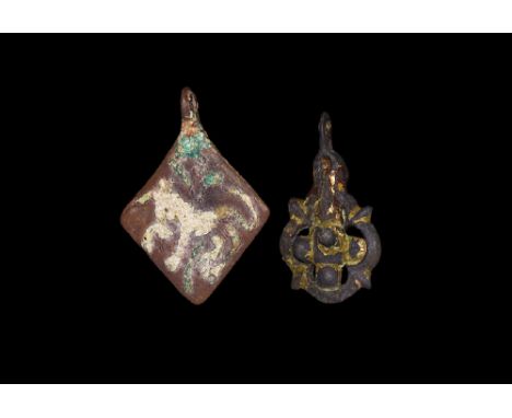 14th-15th century AD. Group comprising: a cast lozenge-shaped harness pendant depicting a unicorn passant facing left in whit