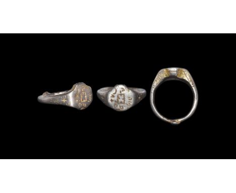 14th-15th century AD. A D-section silver-gilt hoop with expanding shoulders and knop to the underside, cruciform bezel with c