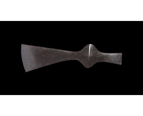 9th-11th century AD. A small hand-forged iron axehead with expanding blade, slightly curved edge, socket with lateral flanges
