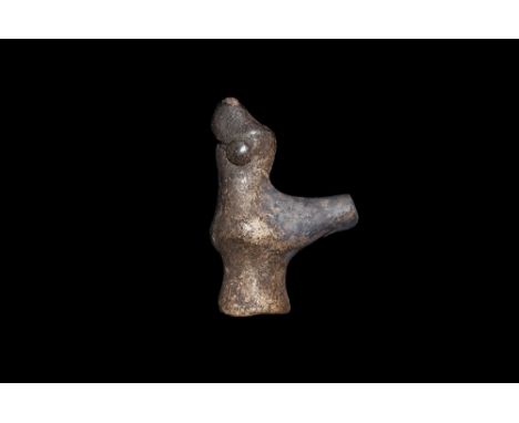 8th-12th century AD. A ceramic whistle in the shape of a bird with head looking up, tail forming blow hole. 15.20 grams, 34mm