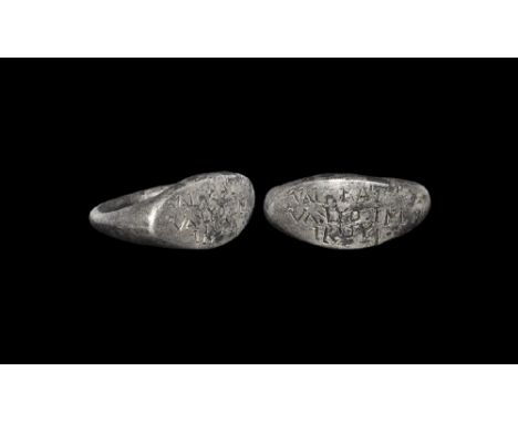 3rd century AD.
A D-section silver hoop with expanding shoulders, scaphoid plaque with enigmatic text in seriffed capitals 'V