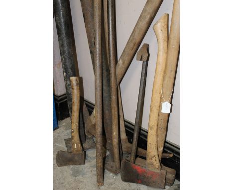 A PAIR OF ACRO PROPS, together with various axes, sledge hammer , pry bars, and road picks