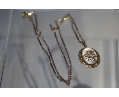 AN ORIENTAL 14K GOLD AND MOTHER OF PEARL PENDANT, stamped 14 k to reverse, suspended on an oriental yellow metal chain bearin