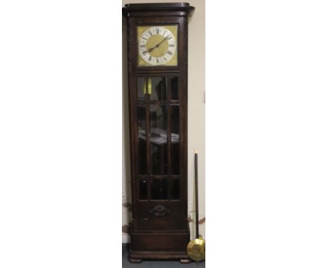 AN EARLY TWENTIETH CENTURY OAK GLAZED LONGCASE CLOCK, with triple weight, the gilt and silvered dial with a Westminster / Whi