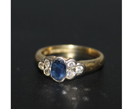 A HALLMARKED 18 CARAT GOLD SAPPHIRE AND DIAMOND RING, approx weight 3.4g, ring size K 1/2Condition Report:Sapphire has some s