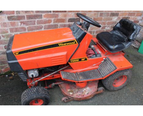 A WESTWOOD T1200 RIDE-ON LAWN TRACTOR WITH A REAR BOX