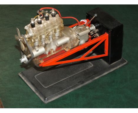 A VINTAGE CUT AWAY MODEL OF A FOUR CYLINDER ENGINE BY GERCHA, 20 x 10 x 14 cm