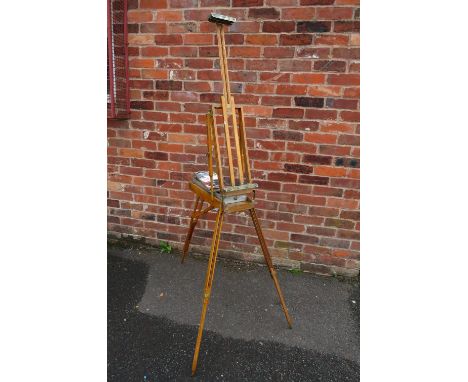 A VINTAGE PORTABLE ARTISTS EASEL, height when closed, 56 cm, width when closed 24 cm