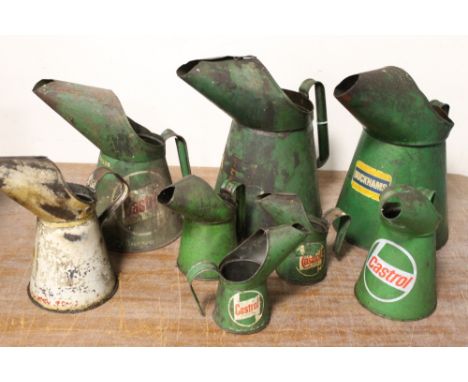 A SELECTION OF EIGHT VINTAGE STEEL OIL POURING CANS INCLUDING CASTROL AND DUCKHAMS, examples ranging from 1/2 pint to 1 gallo
