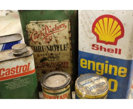 A QUANTITY OF VINTAGE OIL CONTAINERS, together with a selection of grease tins, steel pouring spouts, grease guns and oiling 