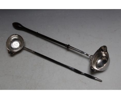 A HALLMARKED GEORGIAN SILVER DOUBLE SPOUTED TODDY LADLE, hallmarks indistinct, on turned handle L 36 cm, together with a whal