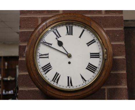 AN ANTIQUE OAK CASED CIRCULAR WALL CLOCK, with single fusee movement, dial Dia. 30 cm, key