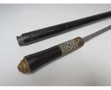 A VINTAGE EBONISED GENTS CANE / SWORD STICK, with lion mask pommel, blade length 56 cm, overall length 92 cm