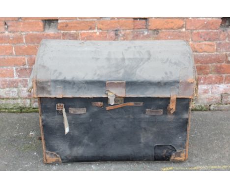 A LARGE VINTAGE DOMED TRAVELLING TRUNK, with leather carry handles, with original paper tag 'T.A.W. Giffard, 16 Alexander Squ