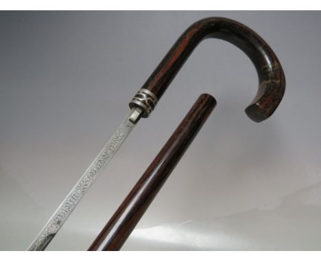 A LATE NINETEENTH / EARLY TWENTIETH CENTURY HARDWOOD GENTS WALKING CANE / SWORD STICK, with decorative white metal collar, th