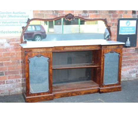 A VICTORIAN ROSEWOOD MARBLE TOPPED MIRRORBACK CHIFFONIER, having a shaped mirror above an inverted breakfront marble top, the