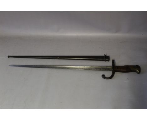 A TWENTIETH CENTURY FRENCH SWORD BAYONET, in metal scabbard, bayonet reg. no. 6669G, length of blade 52 cm, overall length 66