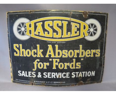 A VINTAGE ENAMELLED SIGN FOR 'HASSLER SHOCK ABSORBERS', W 71 cm