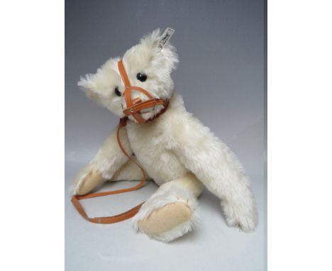 A STEIFF LIMITED MOHAIR 'MUZZLE BEAR 1908', number 3232 of 5000, button in ear, white tag 0174/46, working growler, with box 