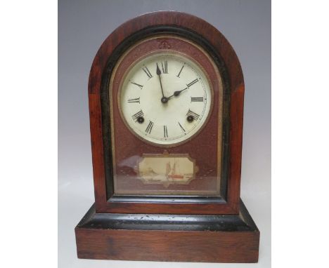 A NINETEENTH CENTURY ROSEWOOD AMERICAN MANTEL CLOCK, the domed case opening from the front, key and pendulum, H 38 cm