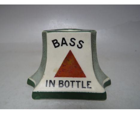 A ROYAL DOULTON CERAMIC 'BASS IN BOTTLE' MATCHSTRIKE, printed marks to base, Rd.No. 47383, W 11 cm, H 7 cm