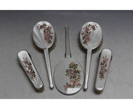 A FIVE PIECE HALLMARKED SILVER AND ENAMEL DRESSING TABLE SET BY W I BROADWAY &amp; CO - BIRMINGHAM 1946/47, consisting of fou