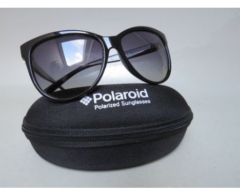 A PAIR OF POLAROID POLARIZED SUNGLASSES, cased with cleaning cloth