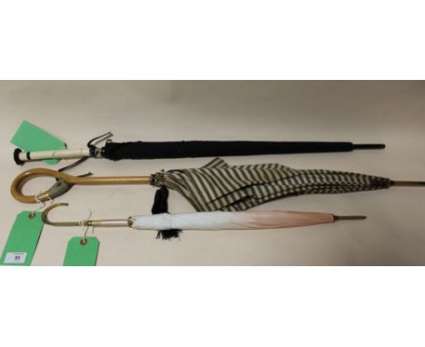 THREE EARLY / MID TWENTIETH CENTURY VINTAGE PARASOLS, one having a carved handle in the form of a ducks head with glass eyes