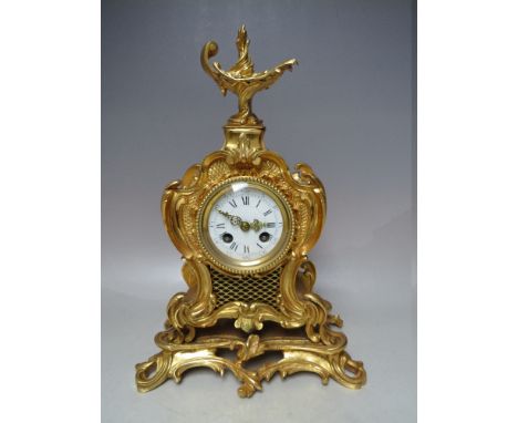 A FINE MID NINETEENTH CENTURY FRENCH ROCOCO MANTEL CLOCK, having bright ormolu case, the mart countwheel strike movement stri