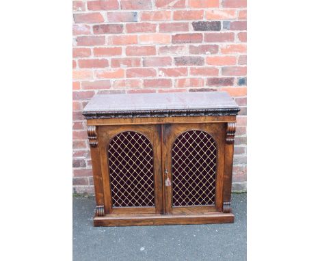 A NINETEENTH CENTURY MARBLE TOP CHIFFONIER OF SMALL PROPORTIONS,  carved detail to the frieze, above twin arched doors with b