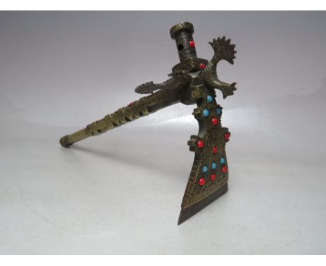 A BRASS PERSIAN SUGAR SALT AXE ADZE, adorned with various coloured cabochons and cockerals to head, L 26 cmCondition Report:O