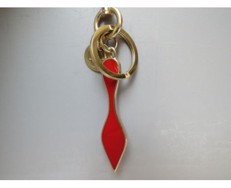 A CHRISTIAN LOUBOUTIN ENAMEL AND GOLDTONE METAL BAG CHARM / KEYRING, approx overall L 16 cm