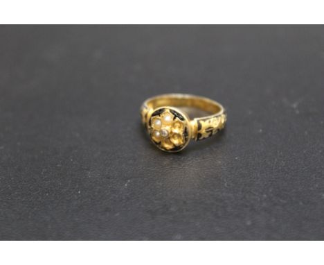 A VICTORIAN 18 CARAT GOLD  MOURNING RING, with central diamond chip detail, seed pearls (three missing), black enamel and ins