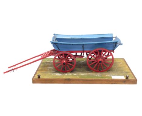 A scale model of a Yorkshire farm wagon, painted in blue and red livery, in travelling case, 61cm wide. 