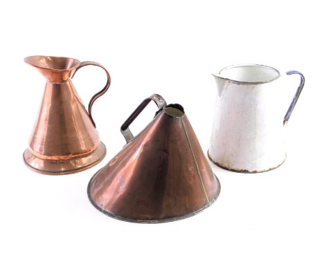 19thC copper wares, comprising a valent jug, 24cm high, a pourer, 25cm high, and a white and blue enamel jug, 22cm high. (3)