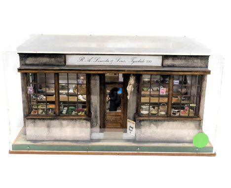 A diorama model of a shop interior, for R&amp;A Lincoln and Sons of Tyndale, containing various miniature cheeses, bread, coo