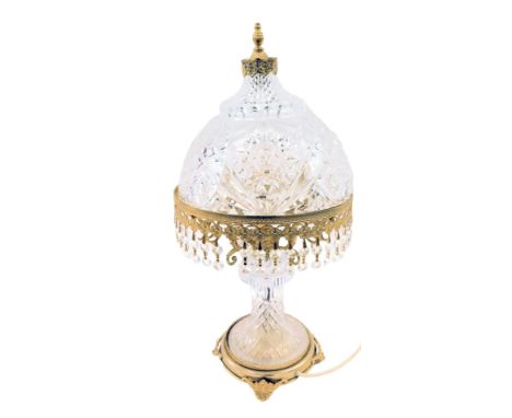 A 19thC brass and pressed glass table lamp, the domed shade of cross hatch decoration with two tier droplets on a circular sh