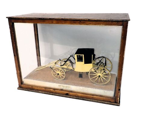 A scale model of a Post Chaise Carriage, circa 1740, in a black and yellow livery, with marooned doors, in perspex case, 60cm