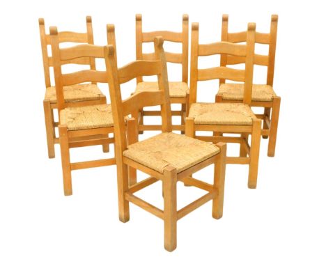 A set of six pale beech ladder back dining chairs, each with a rush seat. 