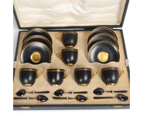 A Royal Worcester black and gold Greek Key design porcelain coffee service, with matching silver black enamel and gilt spoons