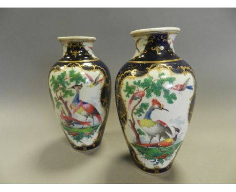 A pair of early 20th century Samson Worcester porcelain style vases decorated with exotic birds